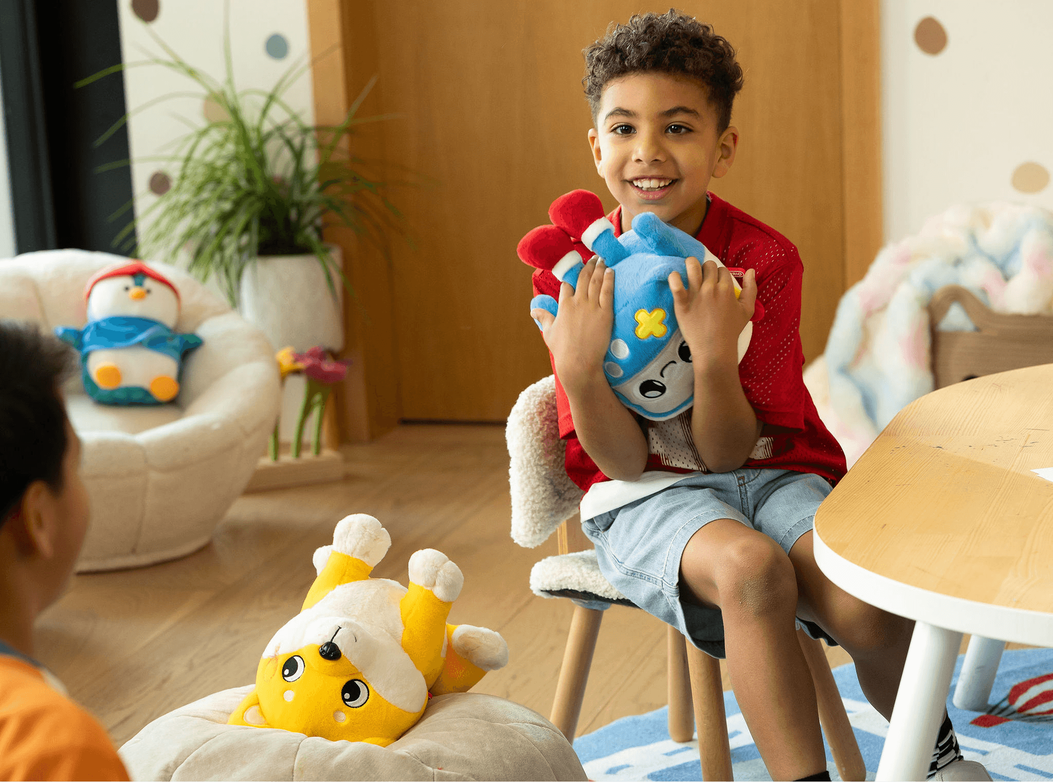 Boy holding Gabbo Curio AI Toy