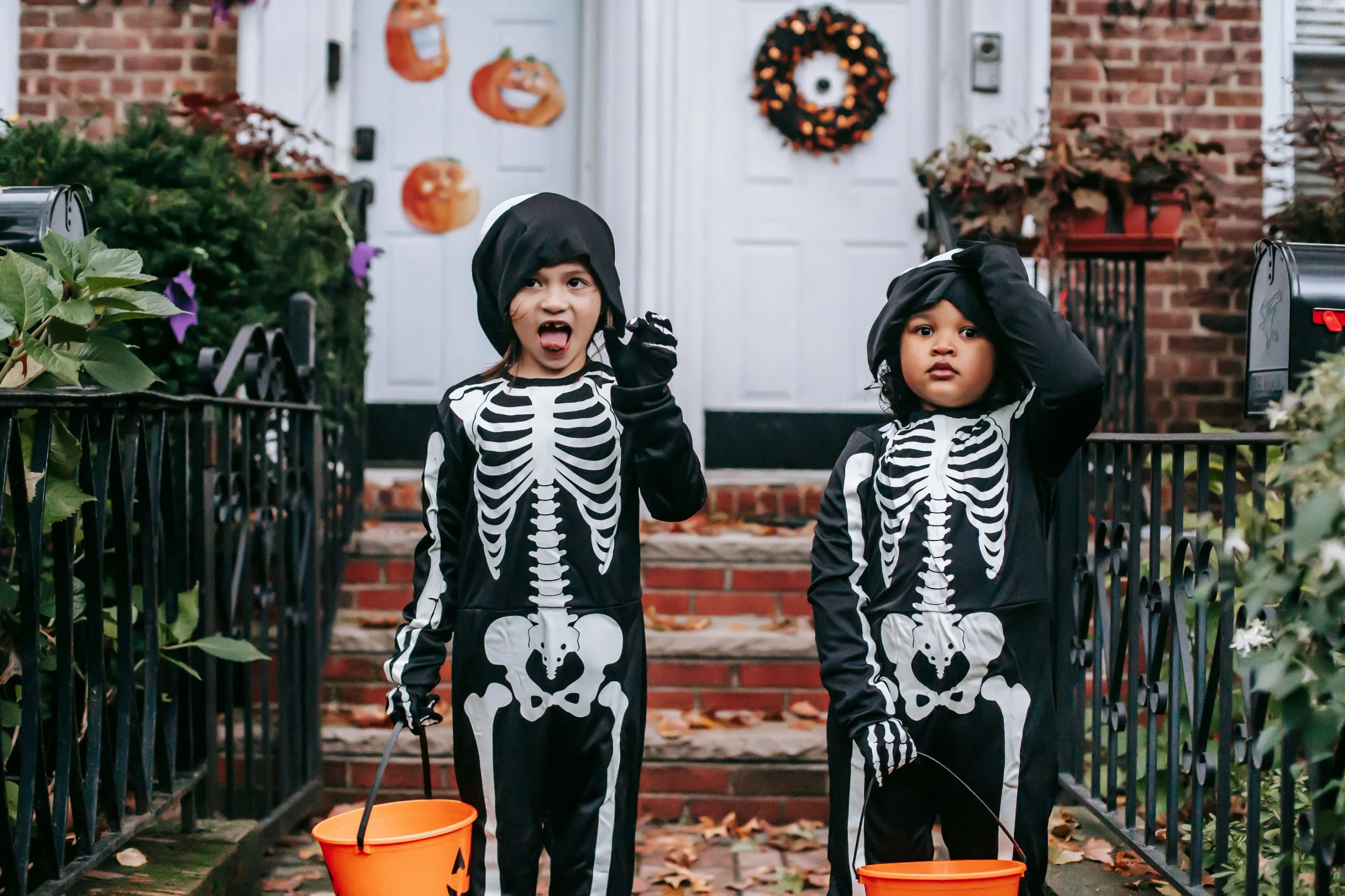Two boys in skeleton costumes